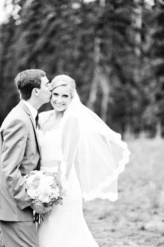 picture of a groom kissing a bride