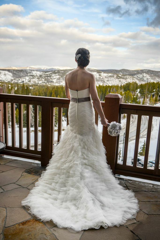 Picture of a bride looking out at the Rocky Mountains